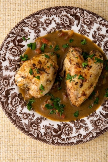 A red eye gravy recipe served with quail on a plate