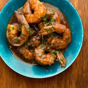 A bowl of New Orleans BBQ shrimp.
