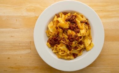 A bowl of homemade pasta and sauce.