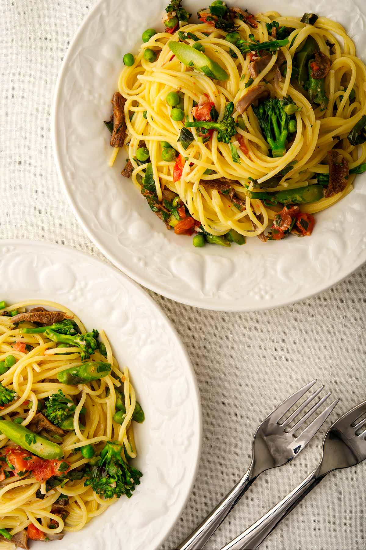 Two bowls of pasta primavera