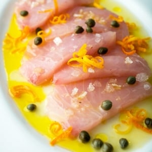 Closeup of tuna crudo on a platter