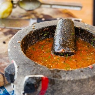 Fire roasted salsa in a molcajete
