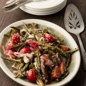 A platter of okra salad with serving plates