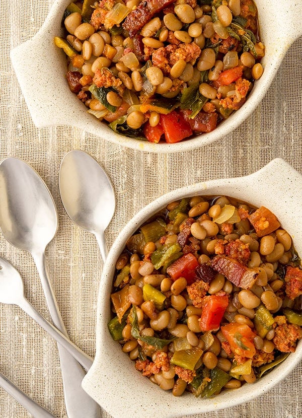 Two bowls of frijoles fronterizos with tepary beans