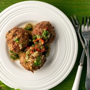 Three Thai meatballs on a plate