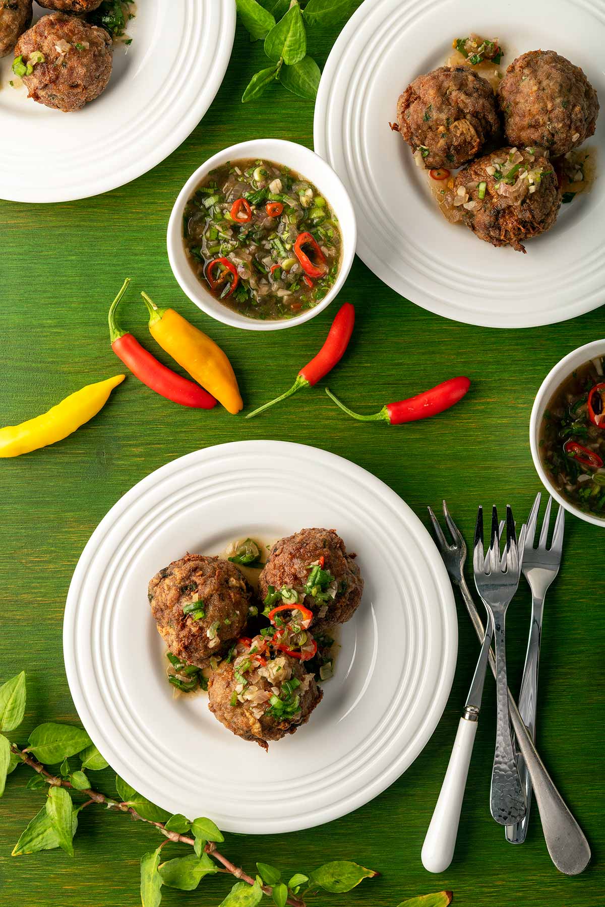 Plates of Thai meatballs with a dipping sauce