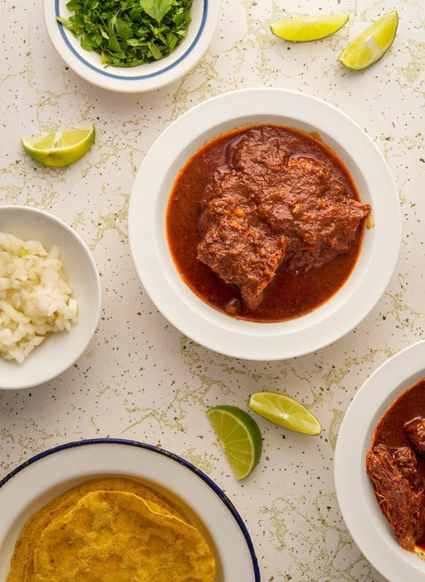 Birria with tortillas and toppings