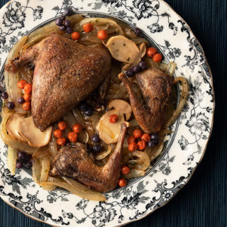 Pan roasted ptarmigan with mushrooms and northern berries.