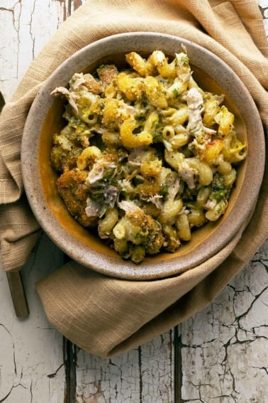 Green chile mac and cheese in a bowl, ready to eat