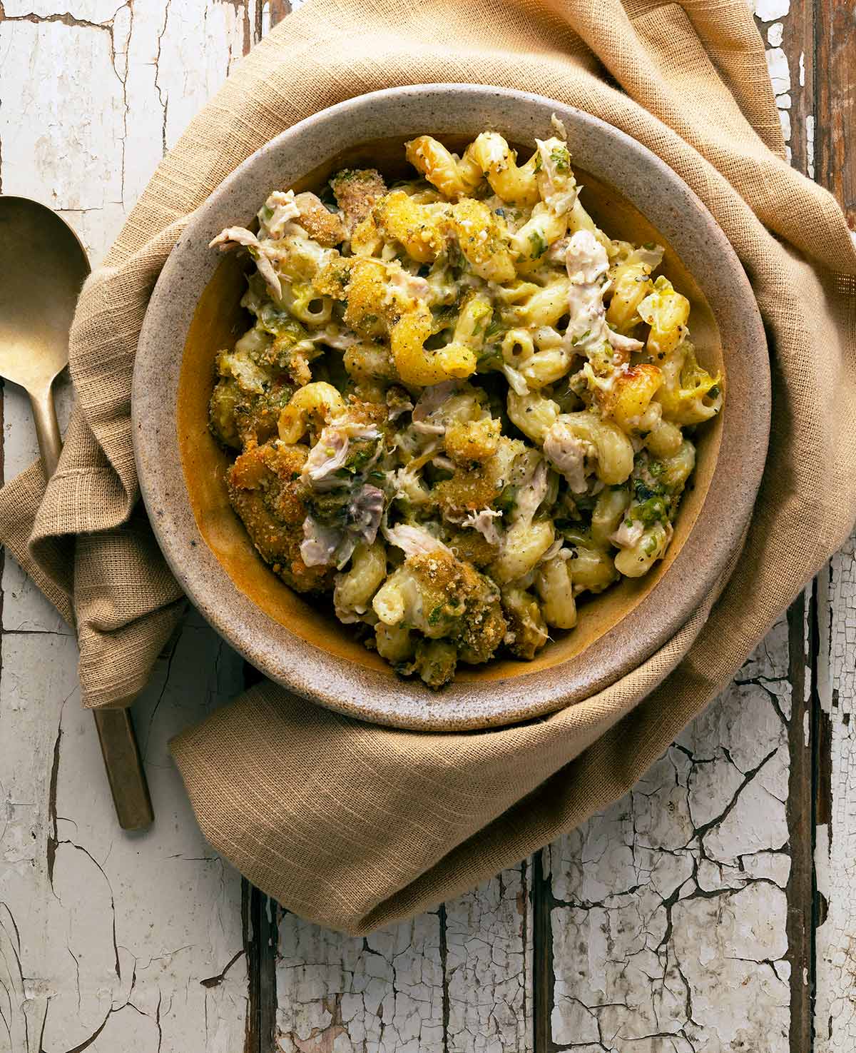 Green chile mac and cheese in a bowl, ready to eat