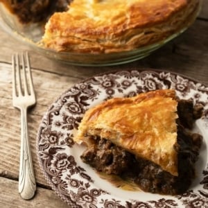 A slice of venison and kidney pie on a plate