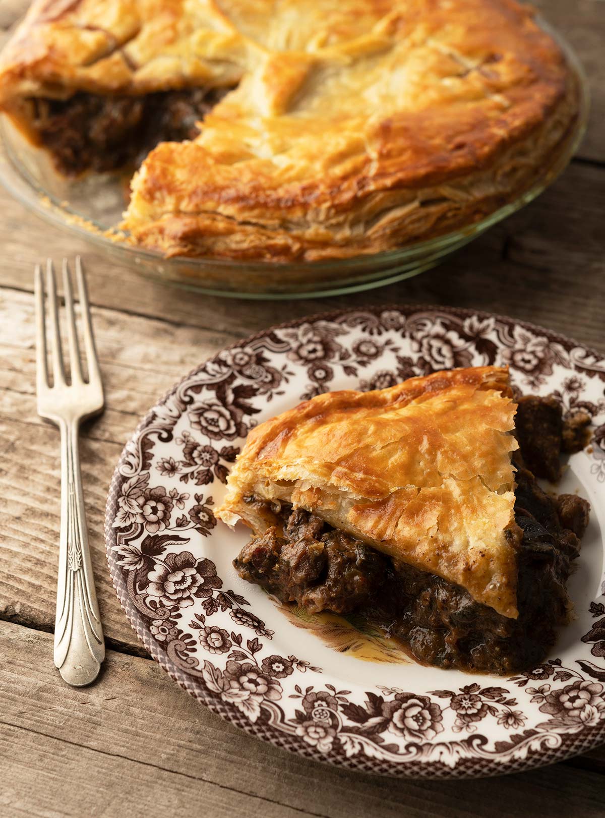 A slice of venison and kidney pie on a plate