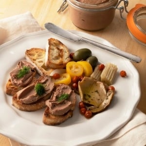 Duck liver pate, garnished with dill, on toast