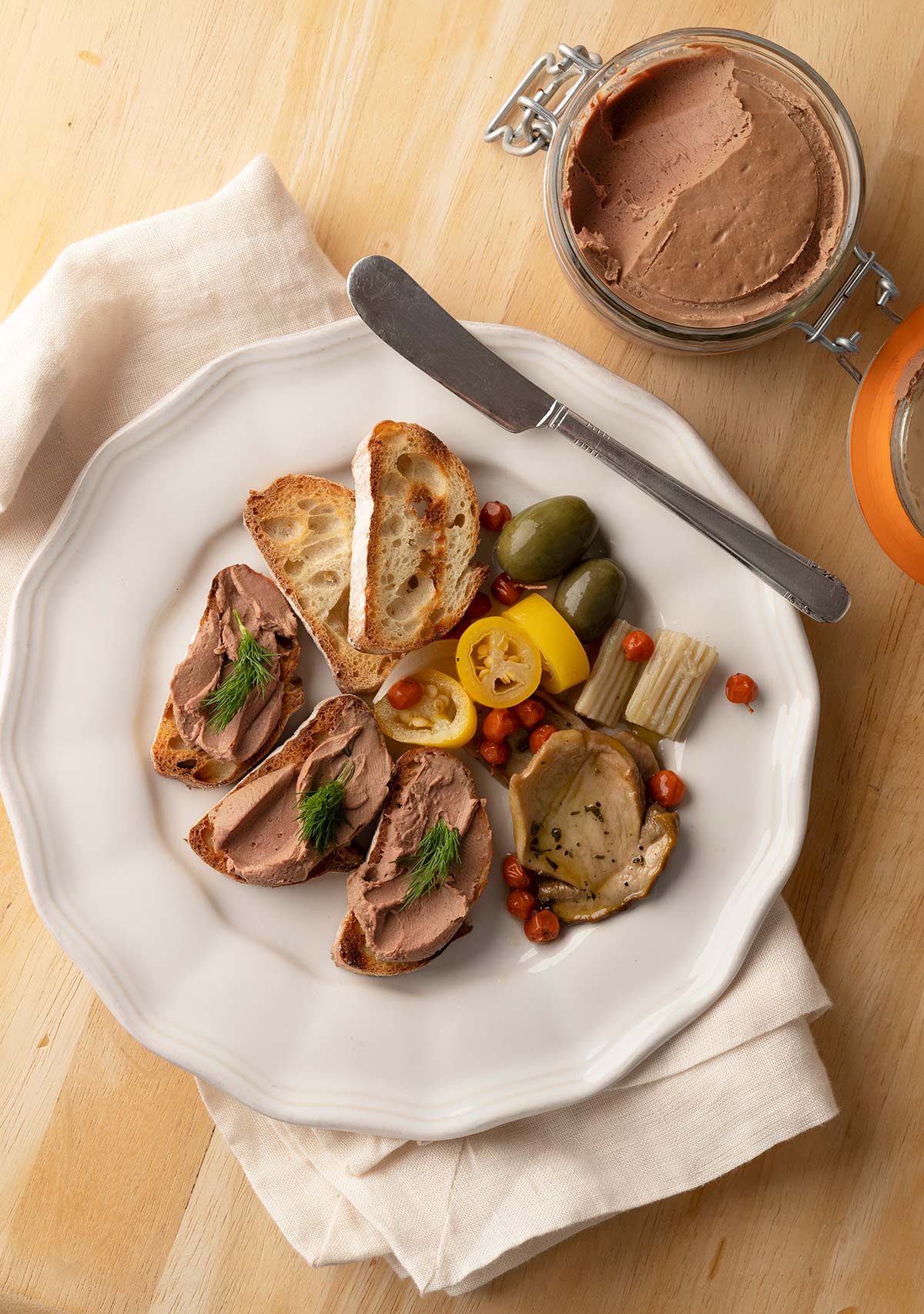 duck liver pate on toast with pickled accompaniments