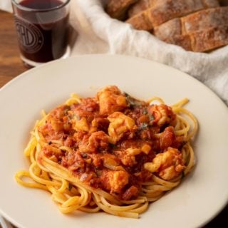 Lobster fra diavolo with spaghetti on a plate