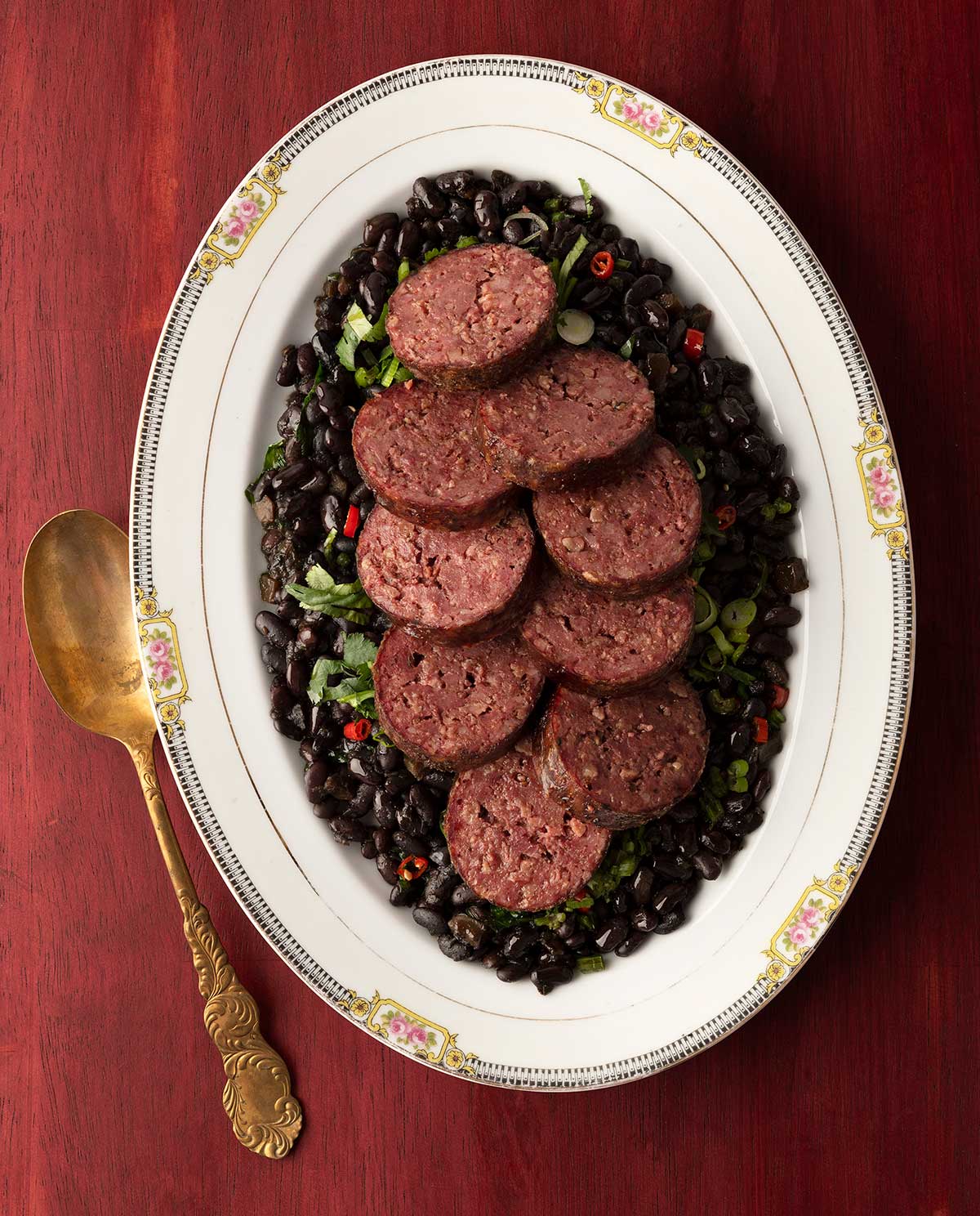 Cooked, sliced cotechino on a platter