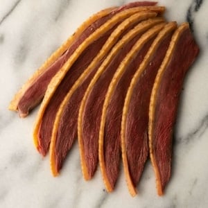 Slices of duck bacon ready to eat