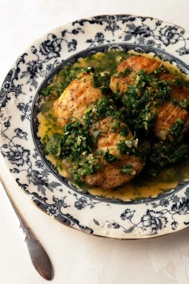 Fish with Spanish green sauce on a plate
