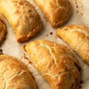 Finished pasty recipe, with pasties cooling on parchment paper