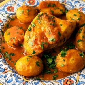 Closeup of Catalan monkfish on a plate with potatoes