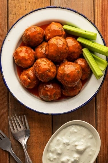 A plate of Buffalo meatballs with blue cheese sauce.
