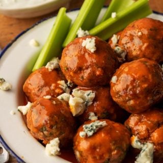 Buffalo Meatballs in a bowl with celery