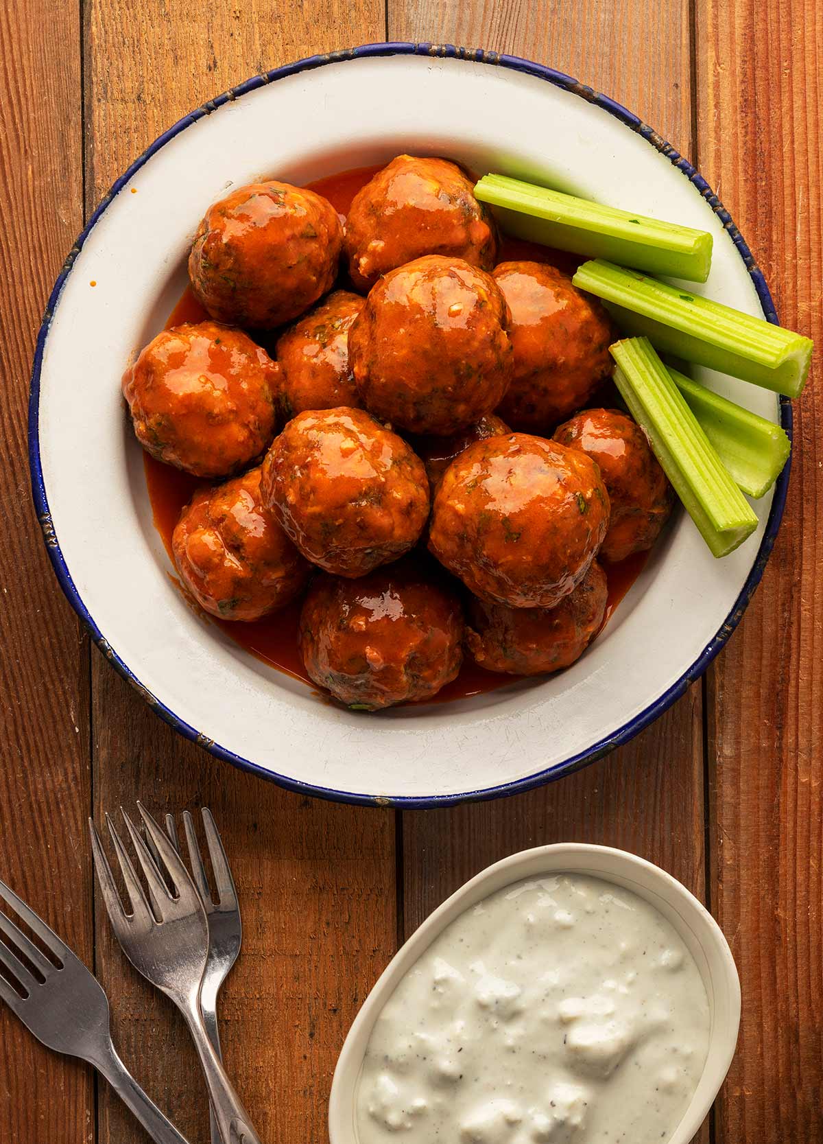 A plate of Buffalo meatballs with blue cheese sauce. 