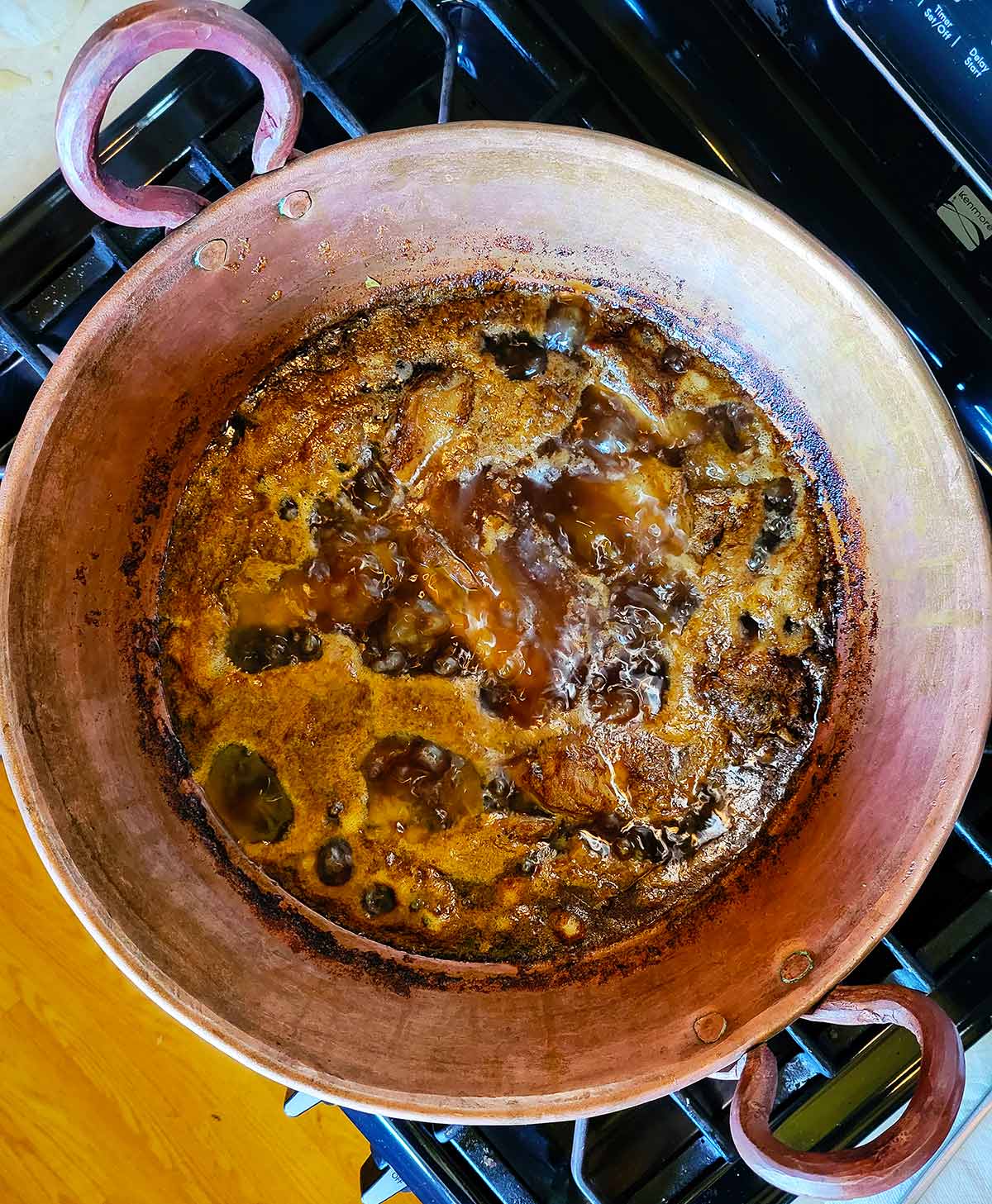 Authentic carnitas cooking in a copper pot