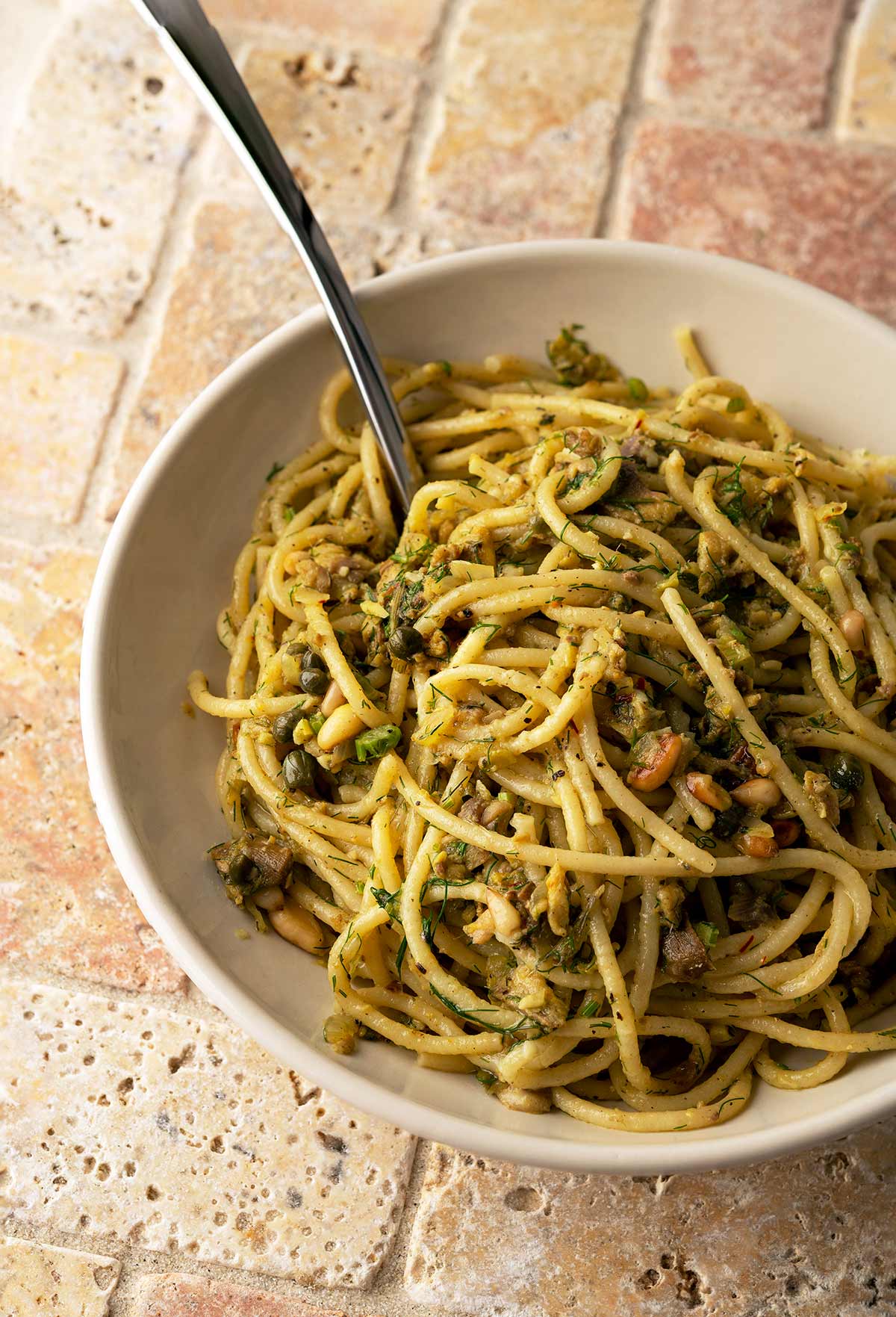 A bowl of pasta with sardines