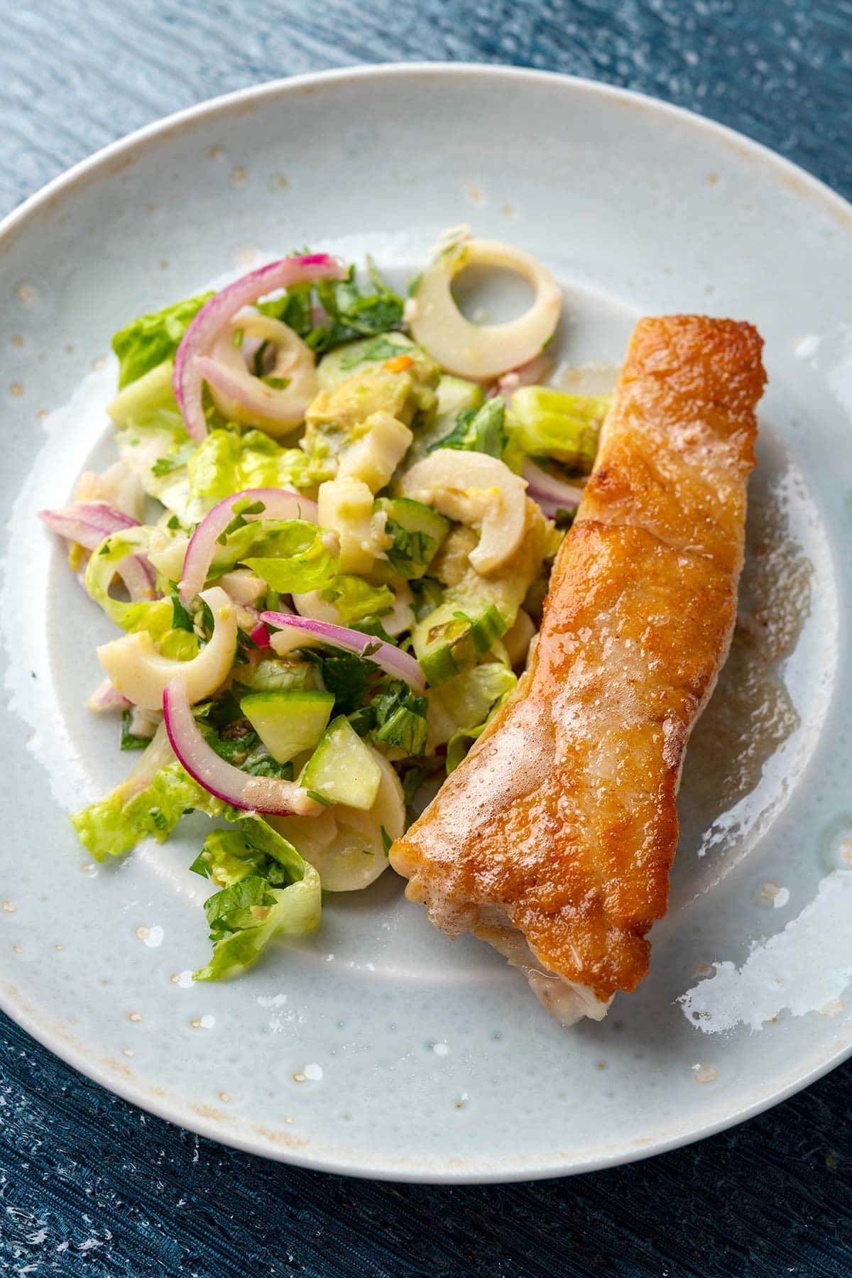 Closeup of pan seared grouper with hearts of palm salad