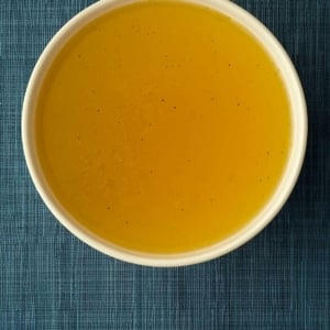 A bowl of clear seafood stock