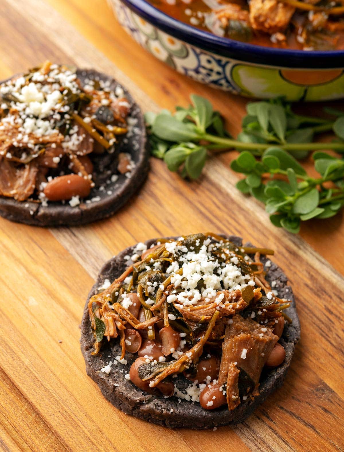 Homemade sopes filled with pork and purslane