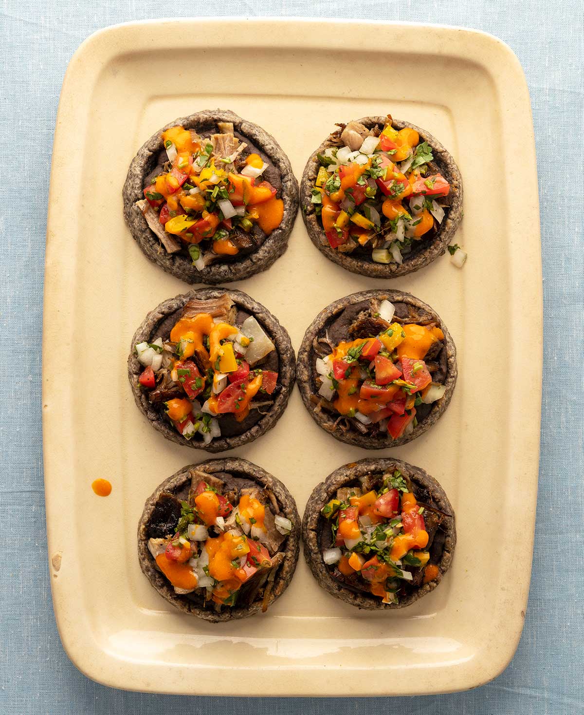 Six Mexican sopes on a tray