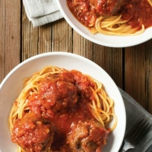 Two bowls of venison meatballs with spaghetti