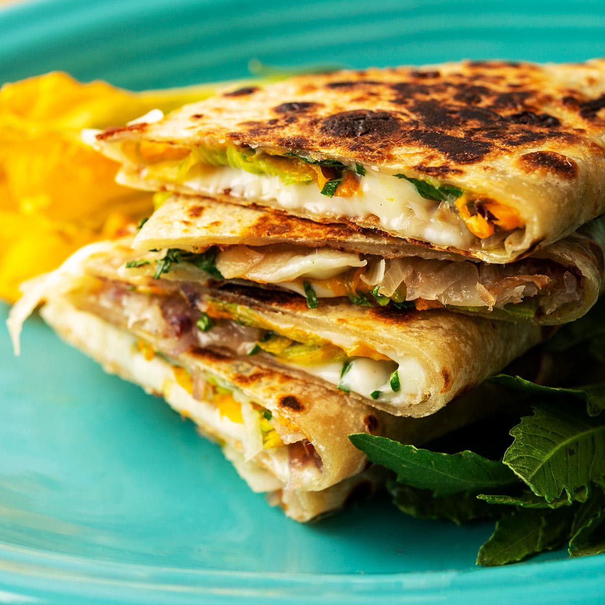 A stack of squash blossom quesadillas