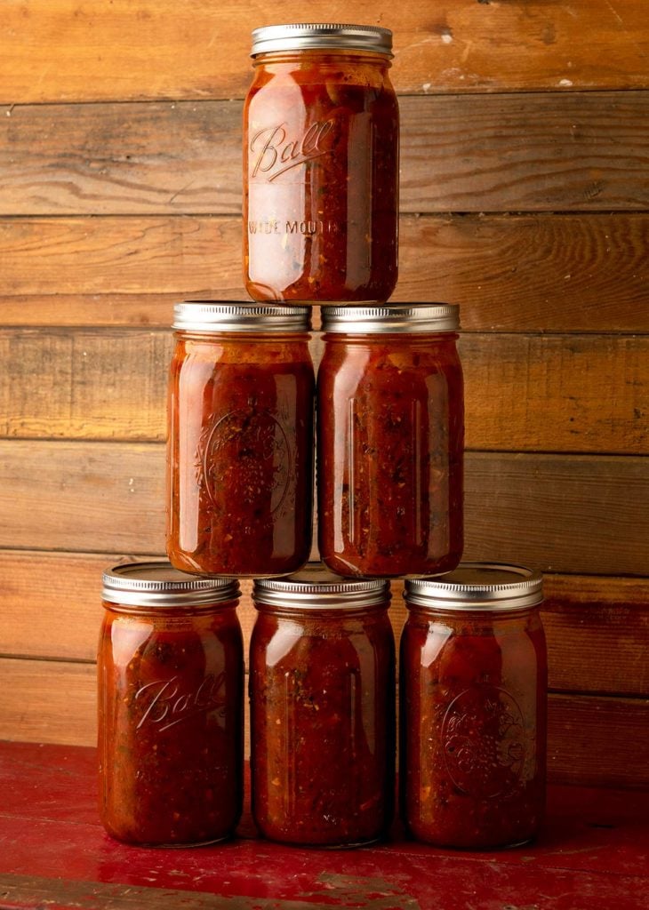 A stack of canned venison spaghetti sauce.