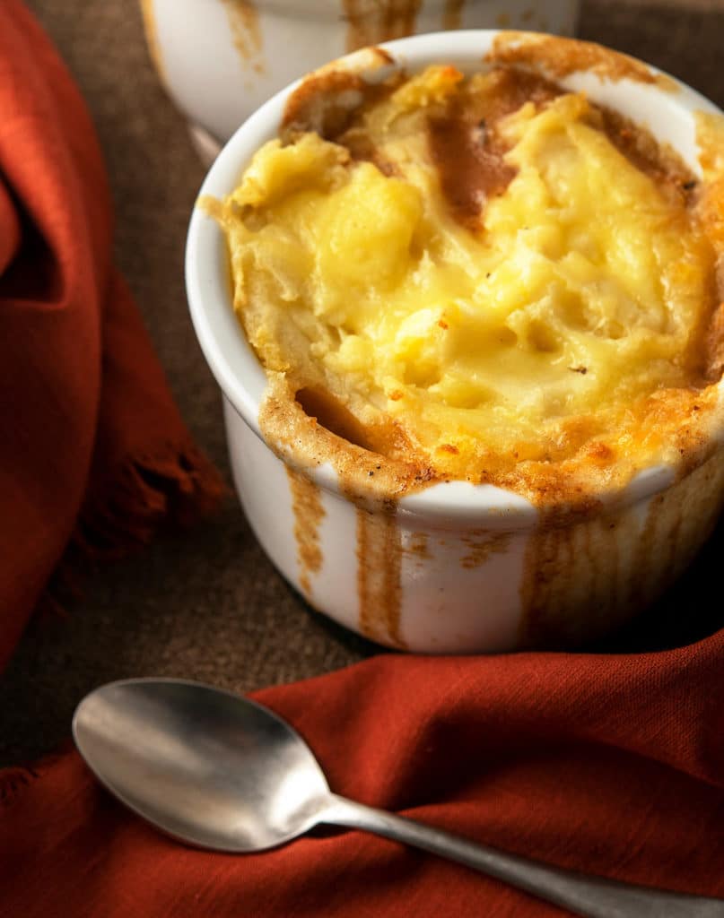 An individual venison shepherd's pie in a ramekin. 