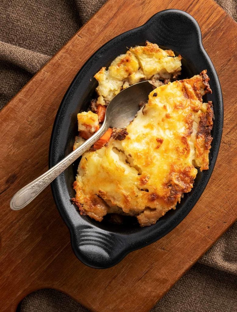 Overhead view of venison shepherd's pie in a baking dish.