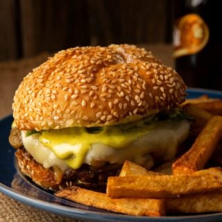 Duck burger on a plate with duck fat fries