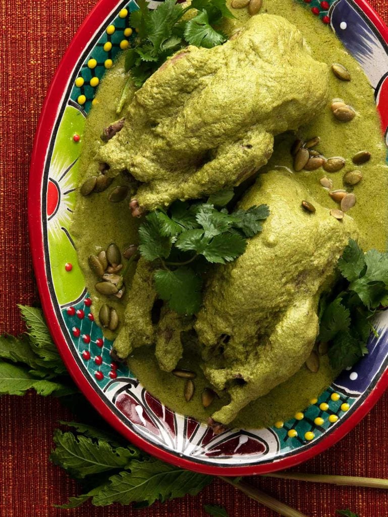 Pipian verde with partridges on a plate. 