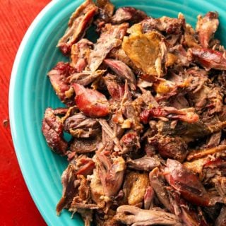 Close up of a platter of pulled duck.