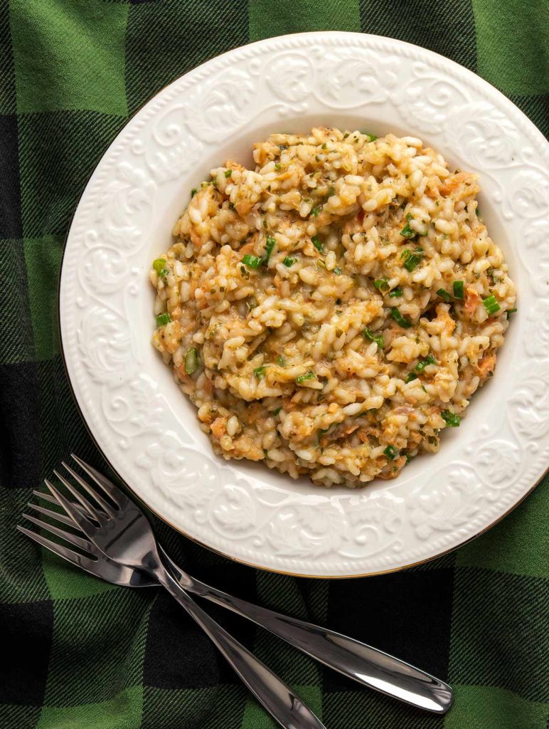 A bowl full of salmon risotto.