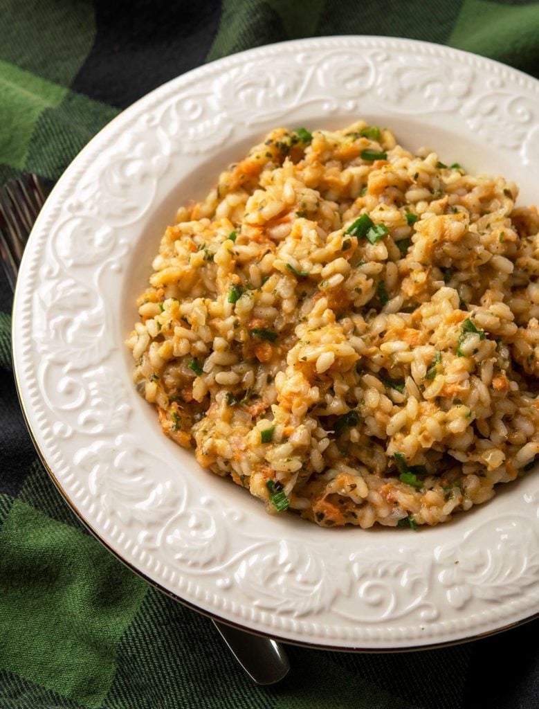 Closeup of a bowl of salmon risotto.