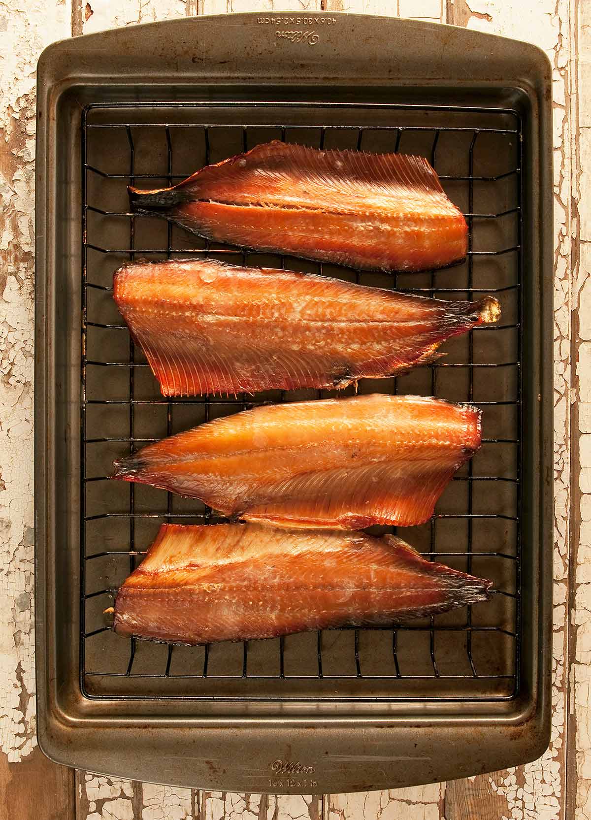 Fillets of smoked shad on a rack. 