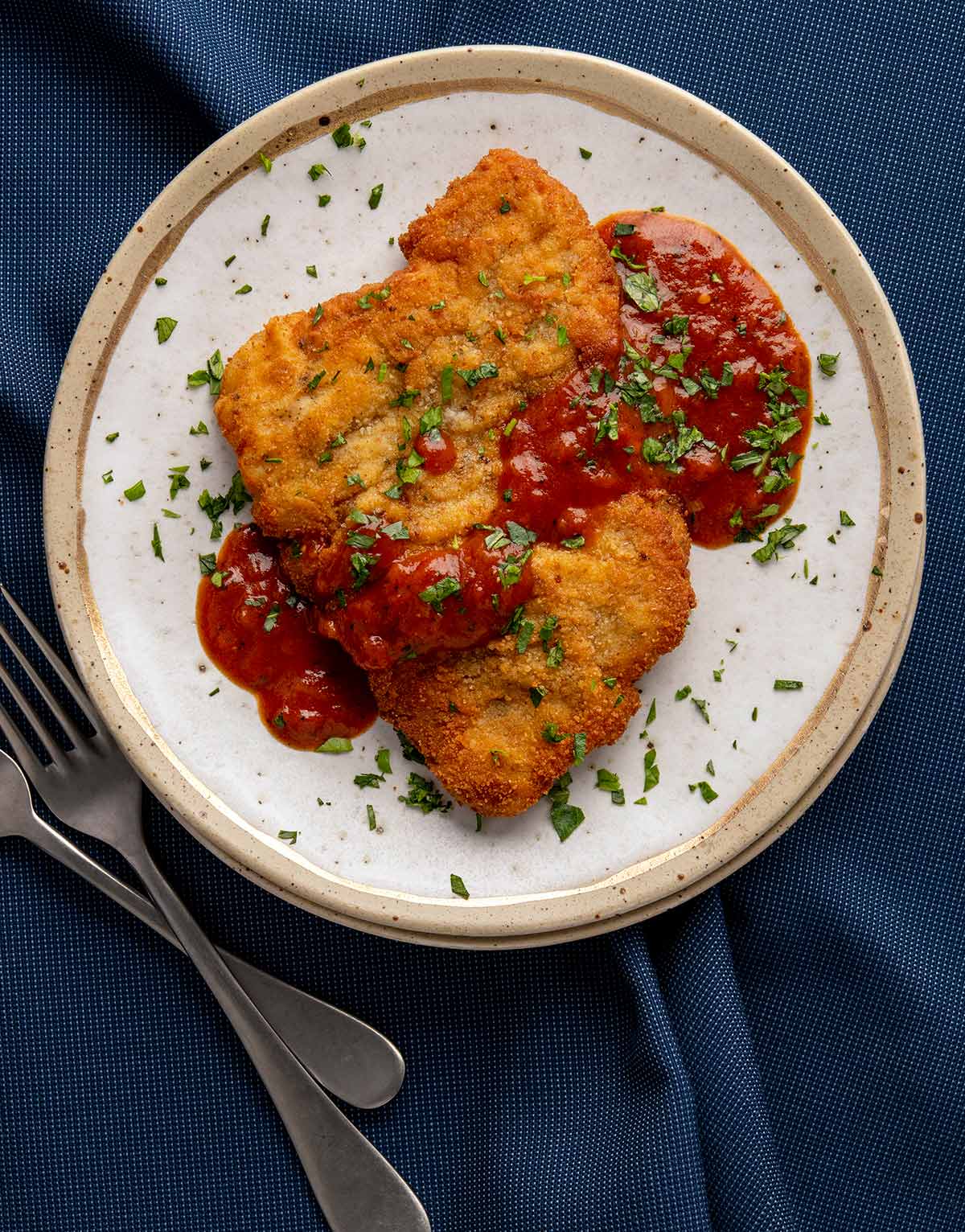 Turkey schnitzel on a plate with Southern tomato gravy. 
