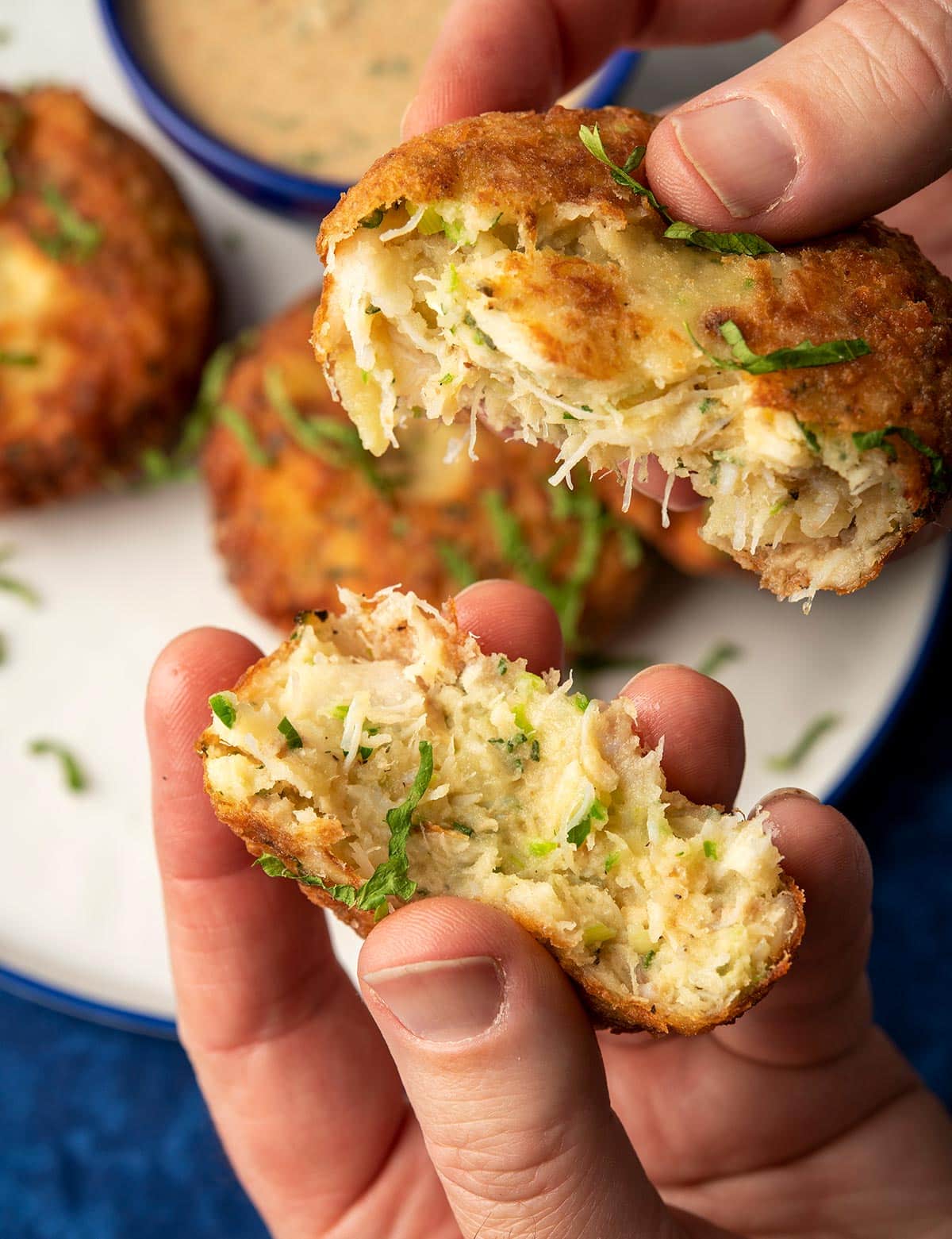 Breaking open a potato fish cake that has some crab in it. 