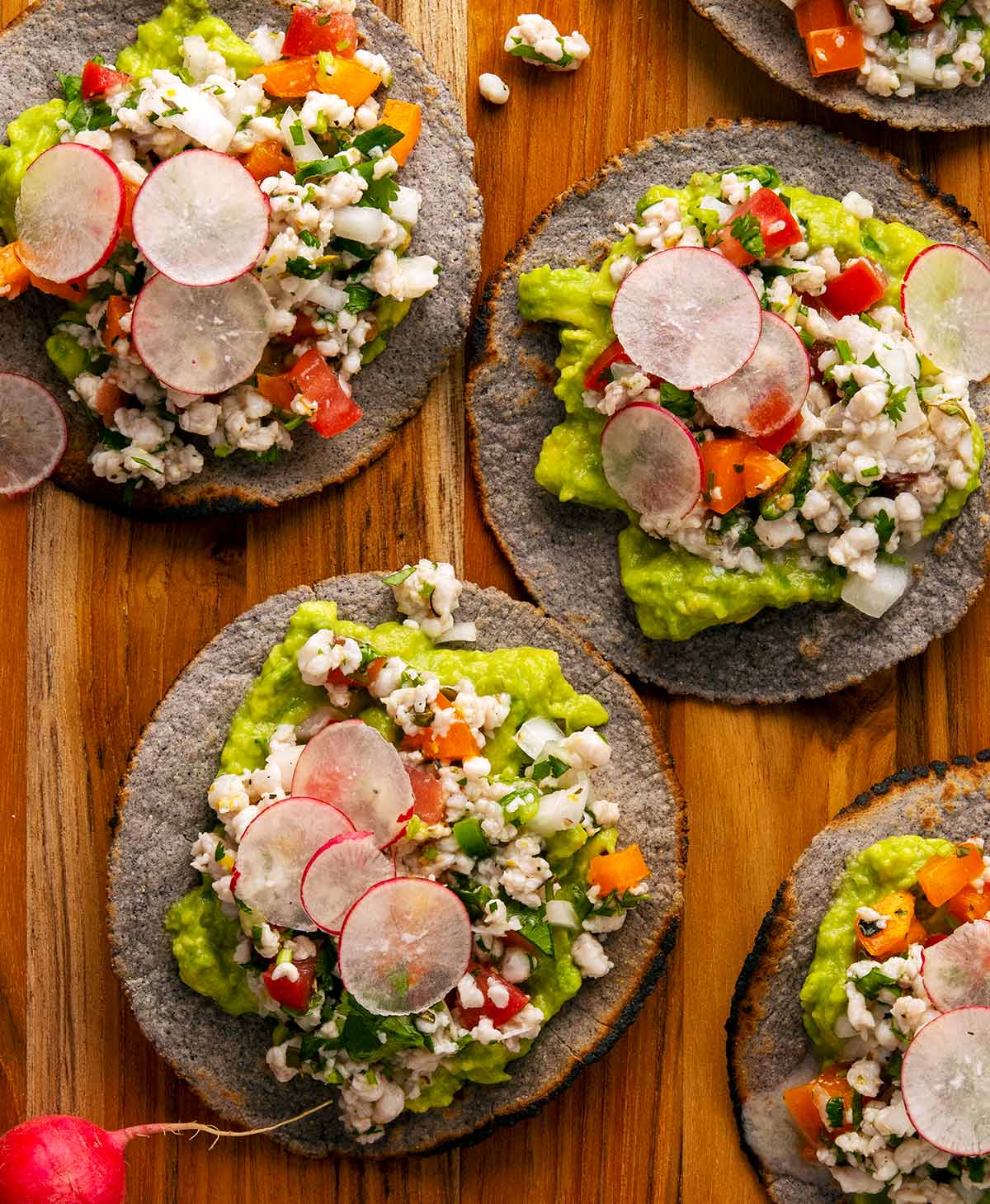 Close up of ceviche tostadas on a platter. 