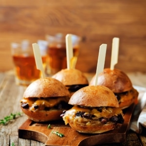 Duck sliders on a cutting board.