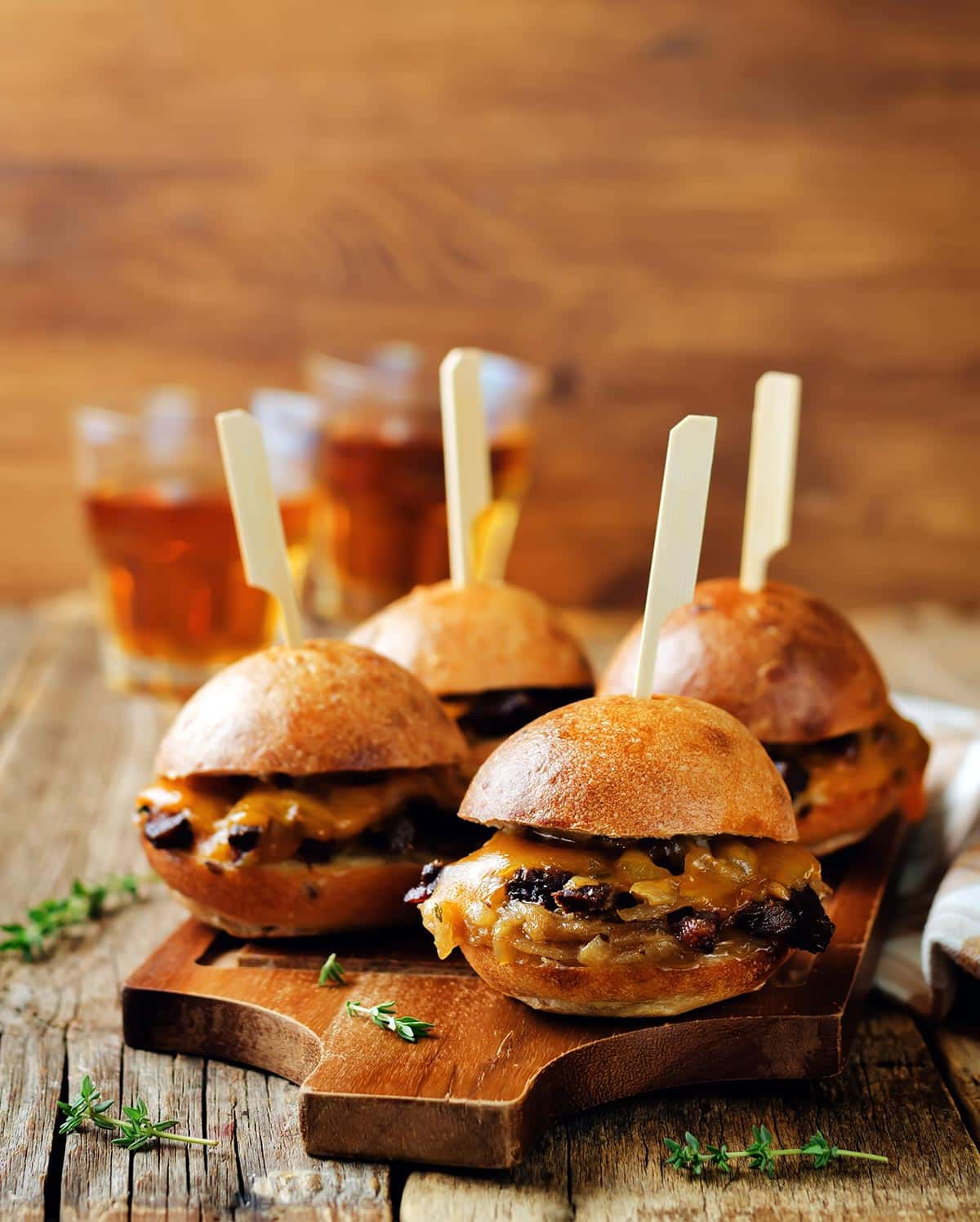 Duck sliders on a cutting board.