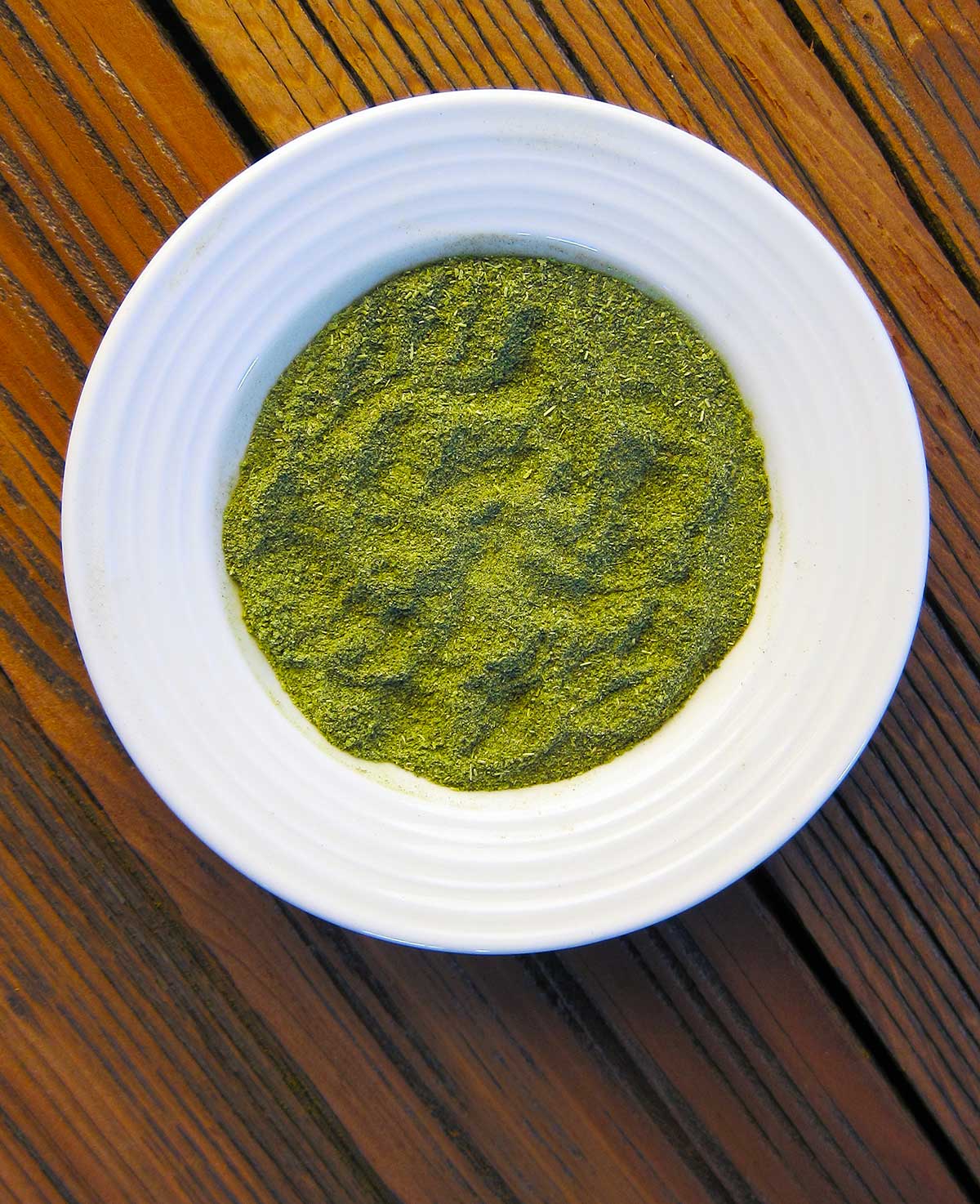 A bowl of green salt, made at home. 